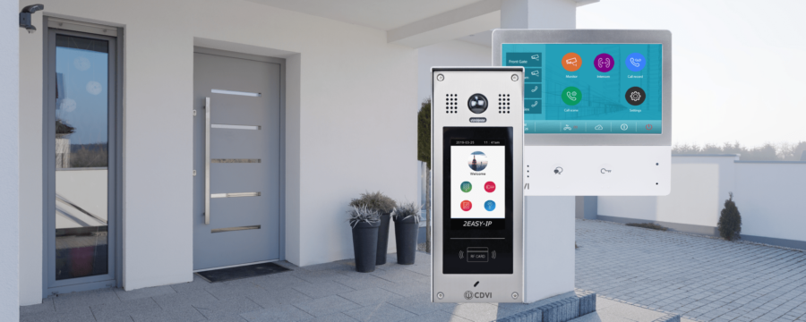 Modern stylish house with grey front door overlaid with video door entry products including an indoor monitor and outdoor external door station