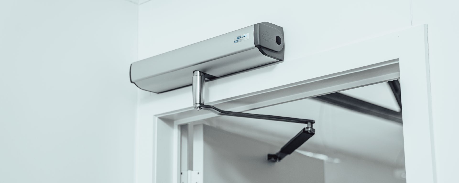 Common mistakes when installing automatic doors | Automatic door operator for swing doors mounted above door frame with door held open