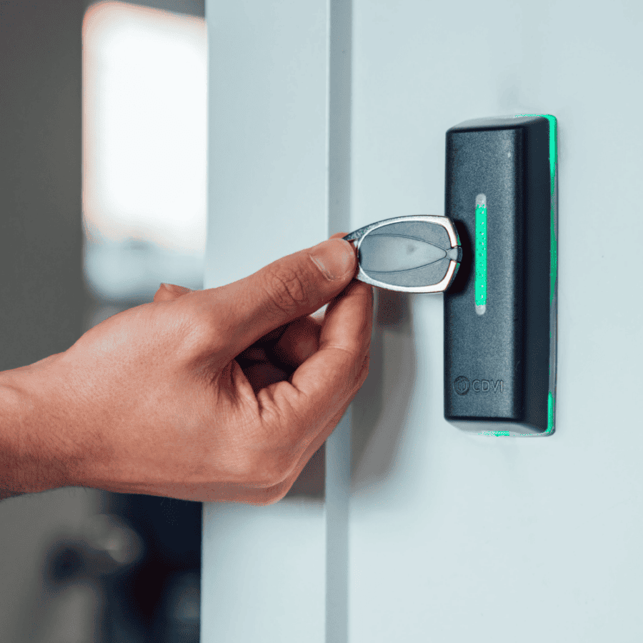 Access control reader with tag credential being presented by outstretched hand
