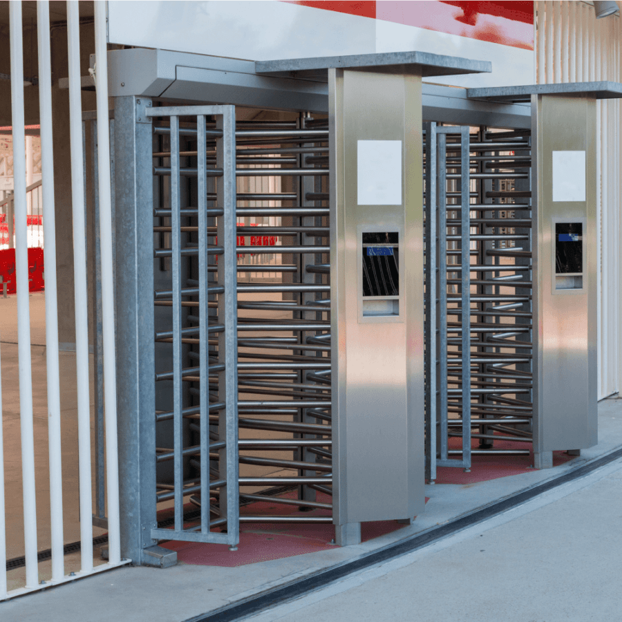 Full-height pedestrian turnstiles at the entrance to a stadium